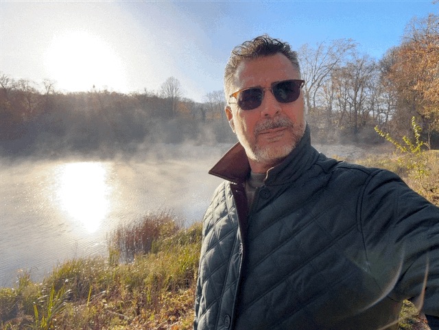 Yasser AlDohaim outdoors by a lake in Ville-d’Avray